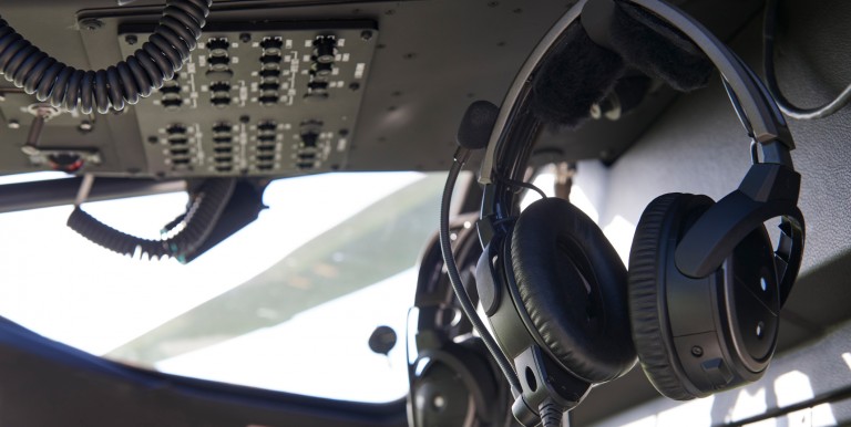 Close Up Of Headsets In Helicopter Cockpit