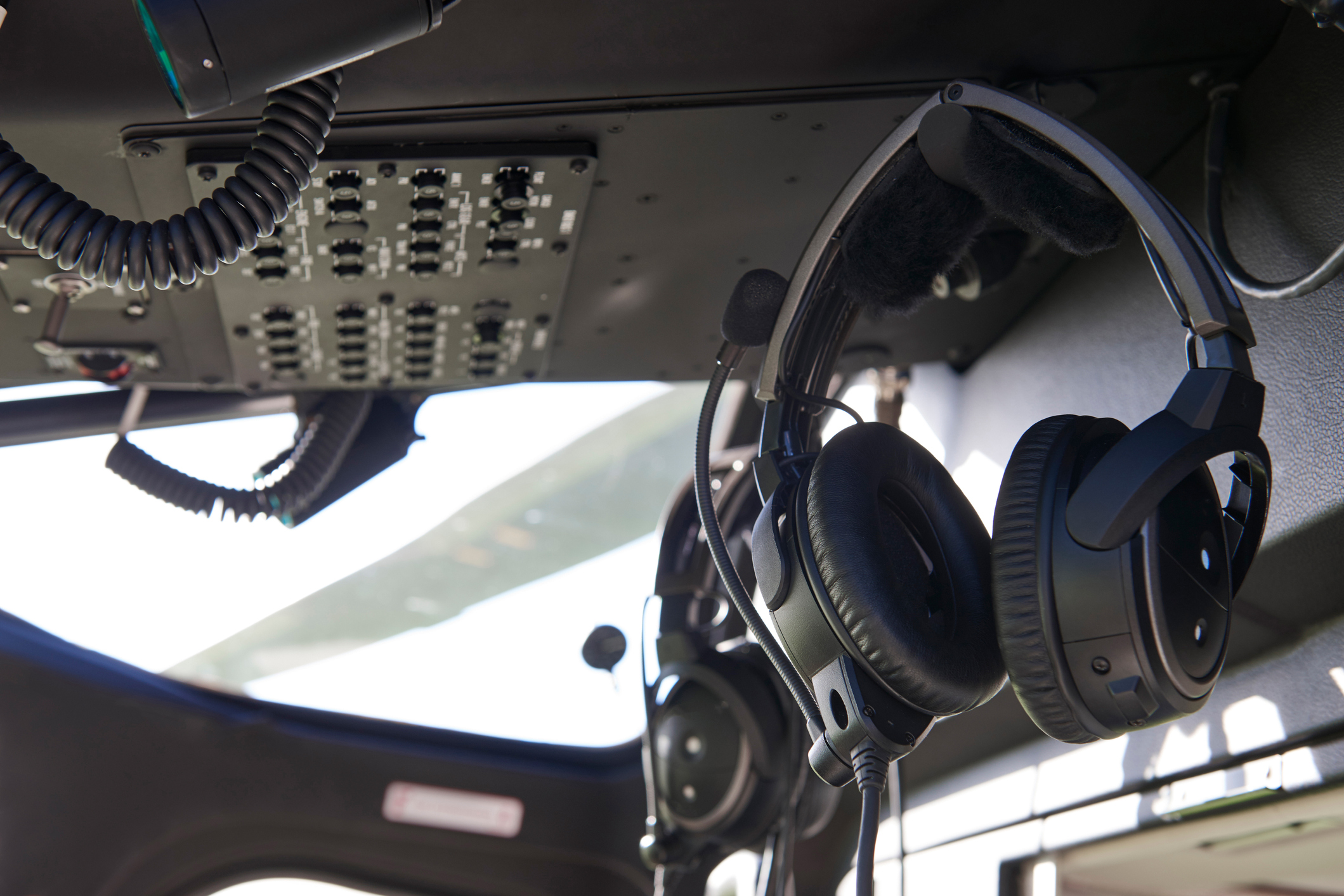 Close Up Of Headsets In Helicopter Cockpit